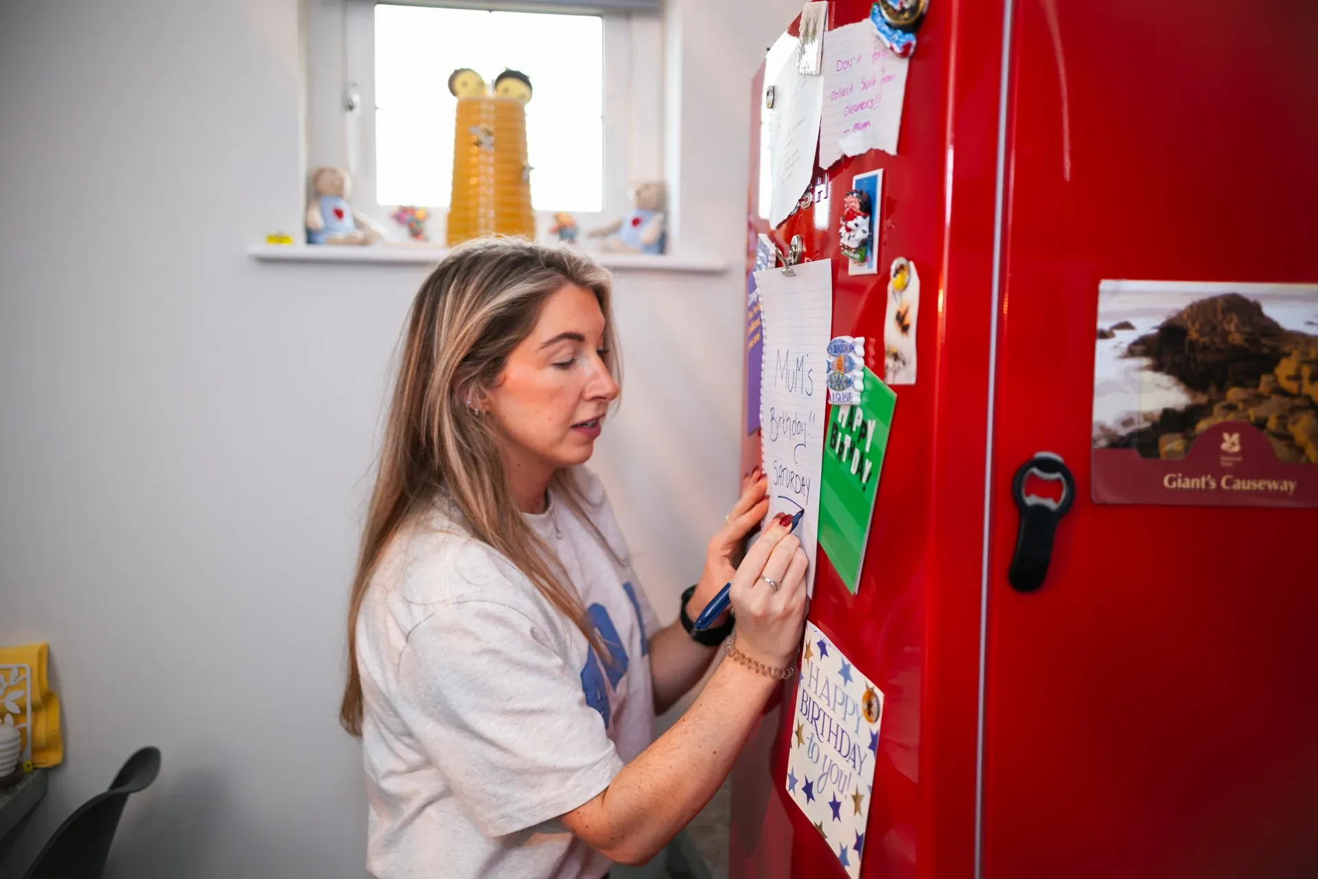 A note on the red fridge — a storytelling detail
