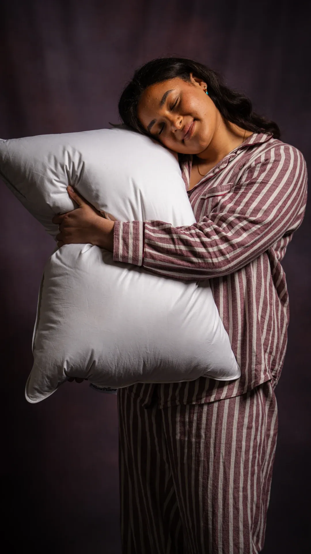 A relaxed portrait with two pillows