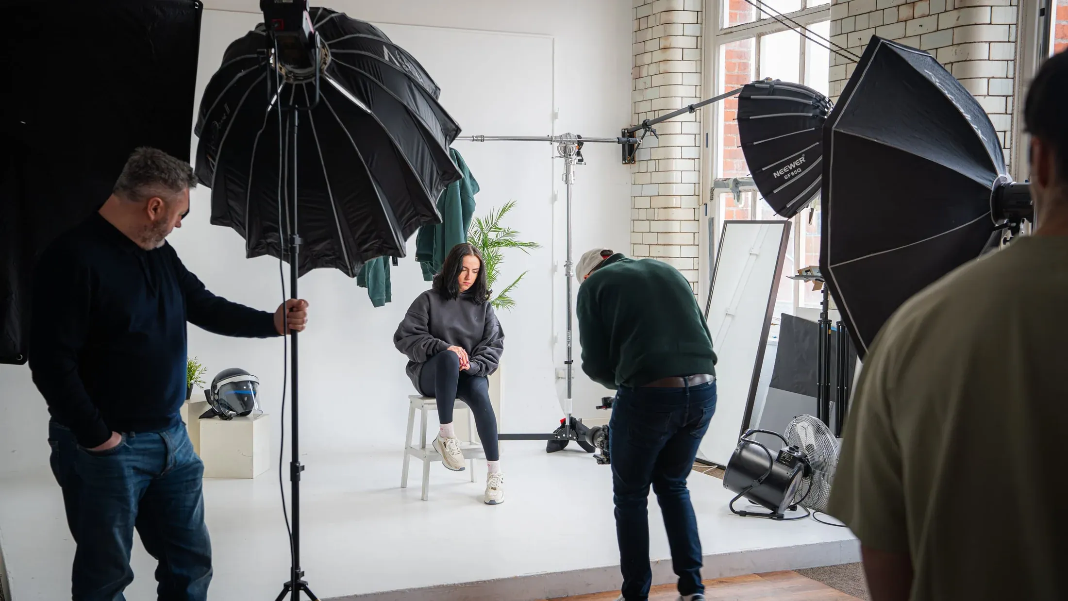 Behind the scenes of a Creative 3 portrait shoot, with cameras and studio lights