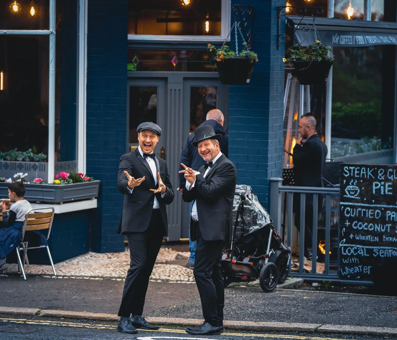 Two people outside a Belfast pub during a location shoot
