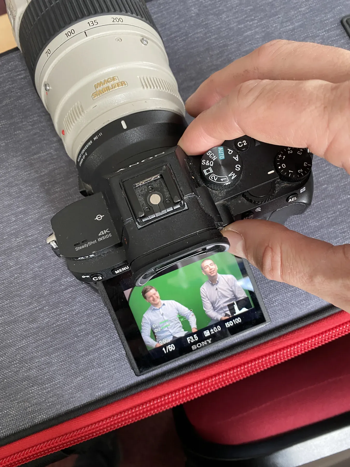 Reviewing a portrait on the rear screen of a Canon camera