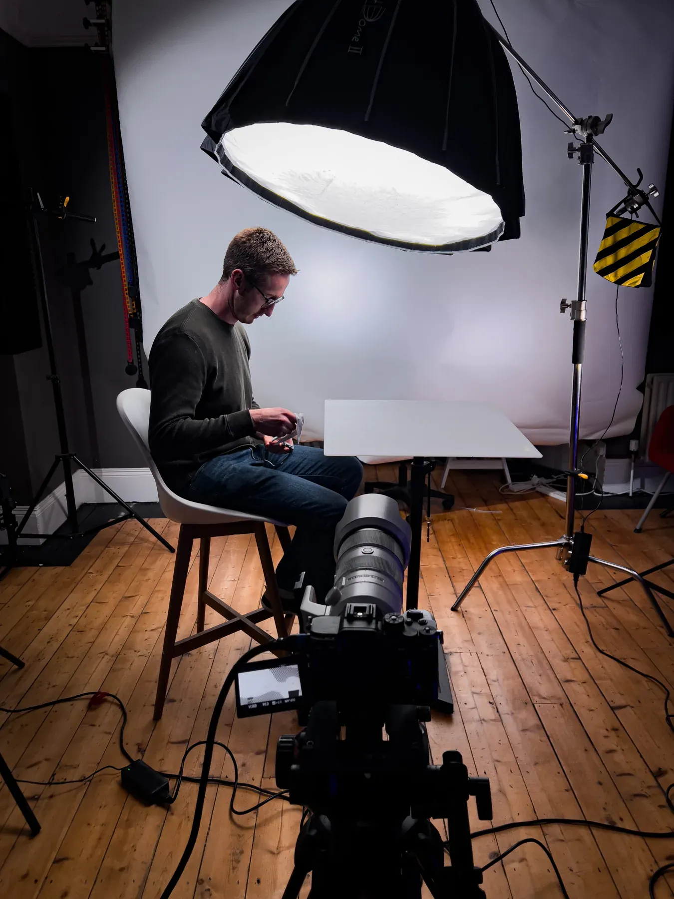 Camera and large softbox lighting an interview