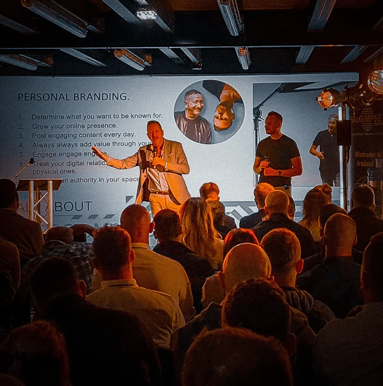 Speakers and audience at a live event