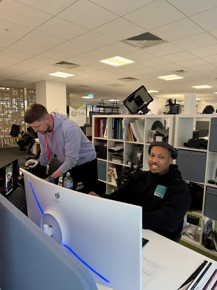 Team members at their office desks