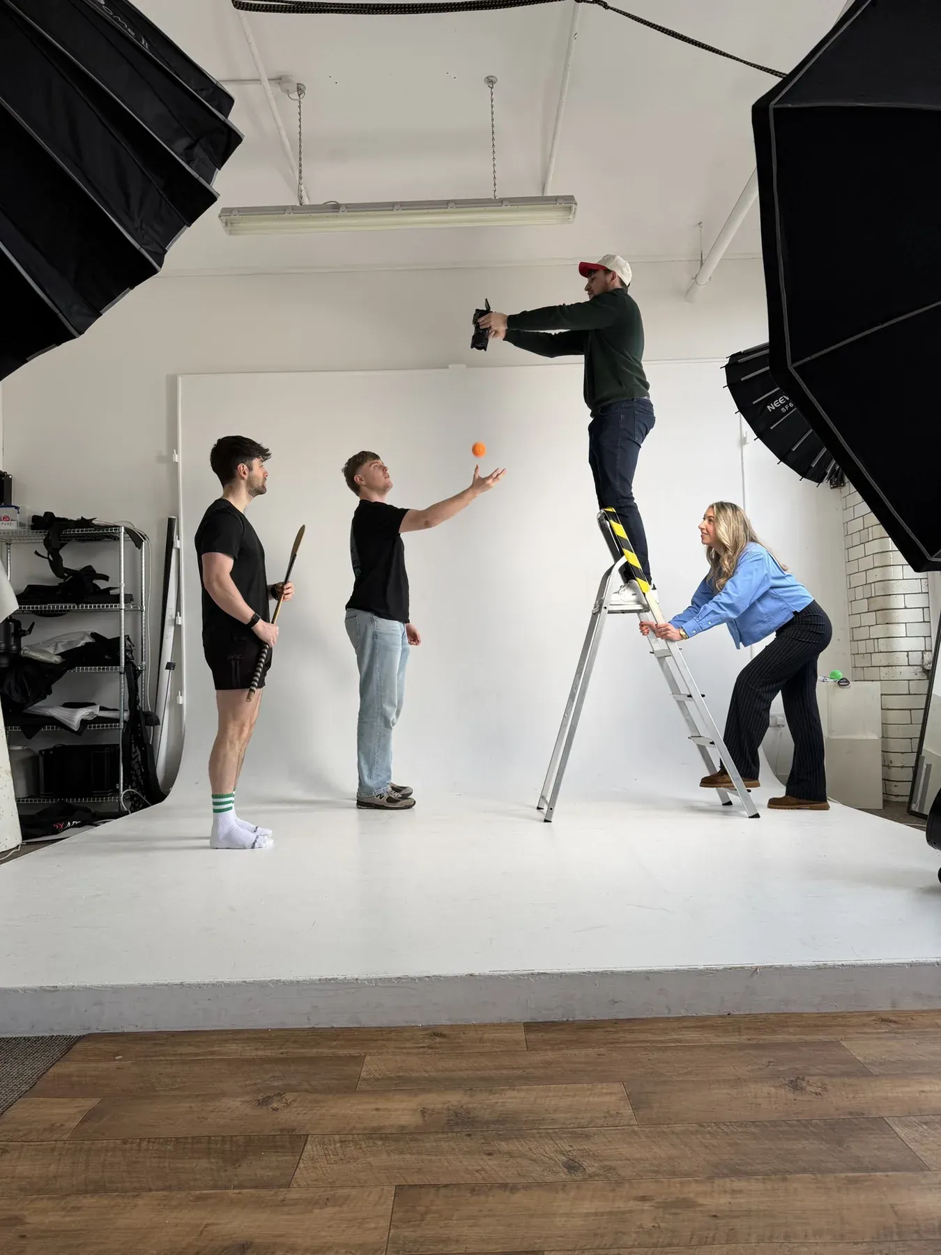 Wide view of a portrait shoot surrounded by softboxes