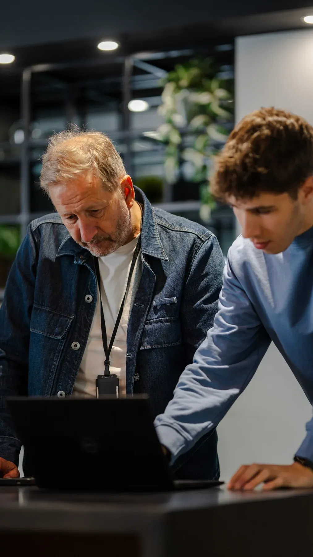 Two people reviewing a laptop together