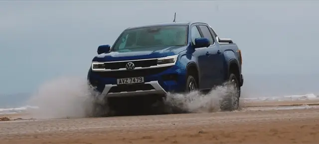 Volkswagen Amarok driving through the surf